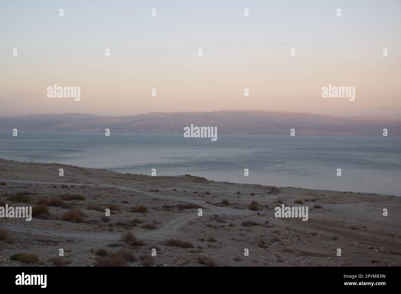 Receding, dried out coastline of the Dead Sea: Driving south on route ...