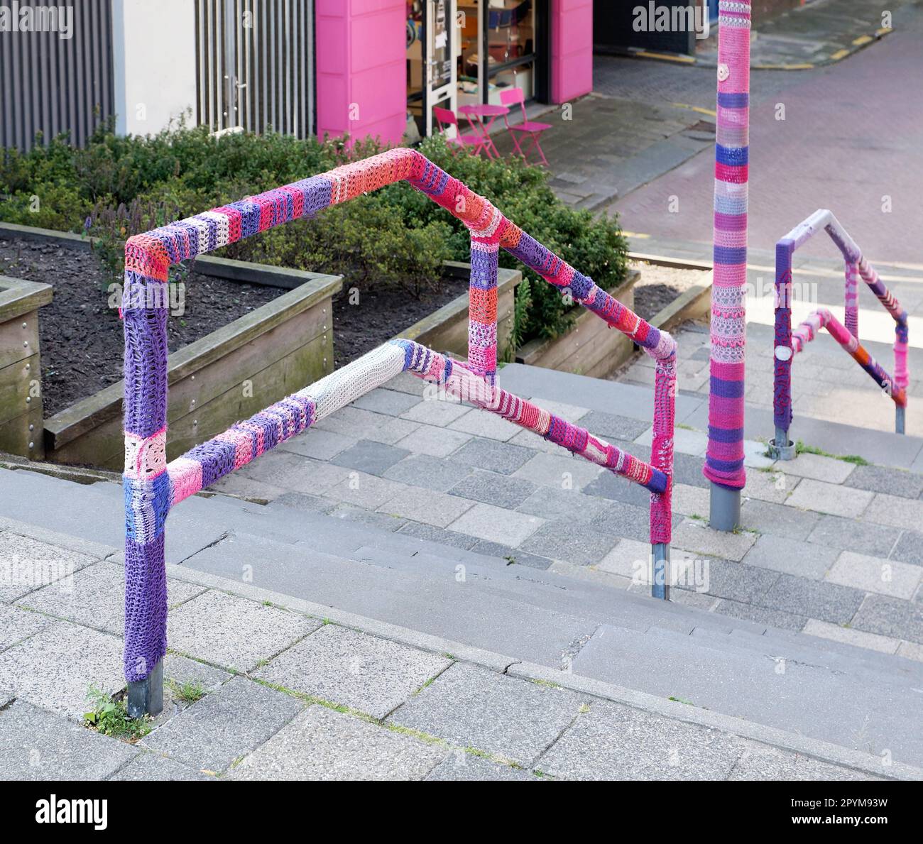 urban knitting is a type of street art also known as yarn bombing, guerilla knitting or kniffiti Stock Photo