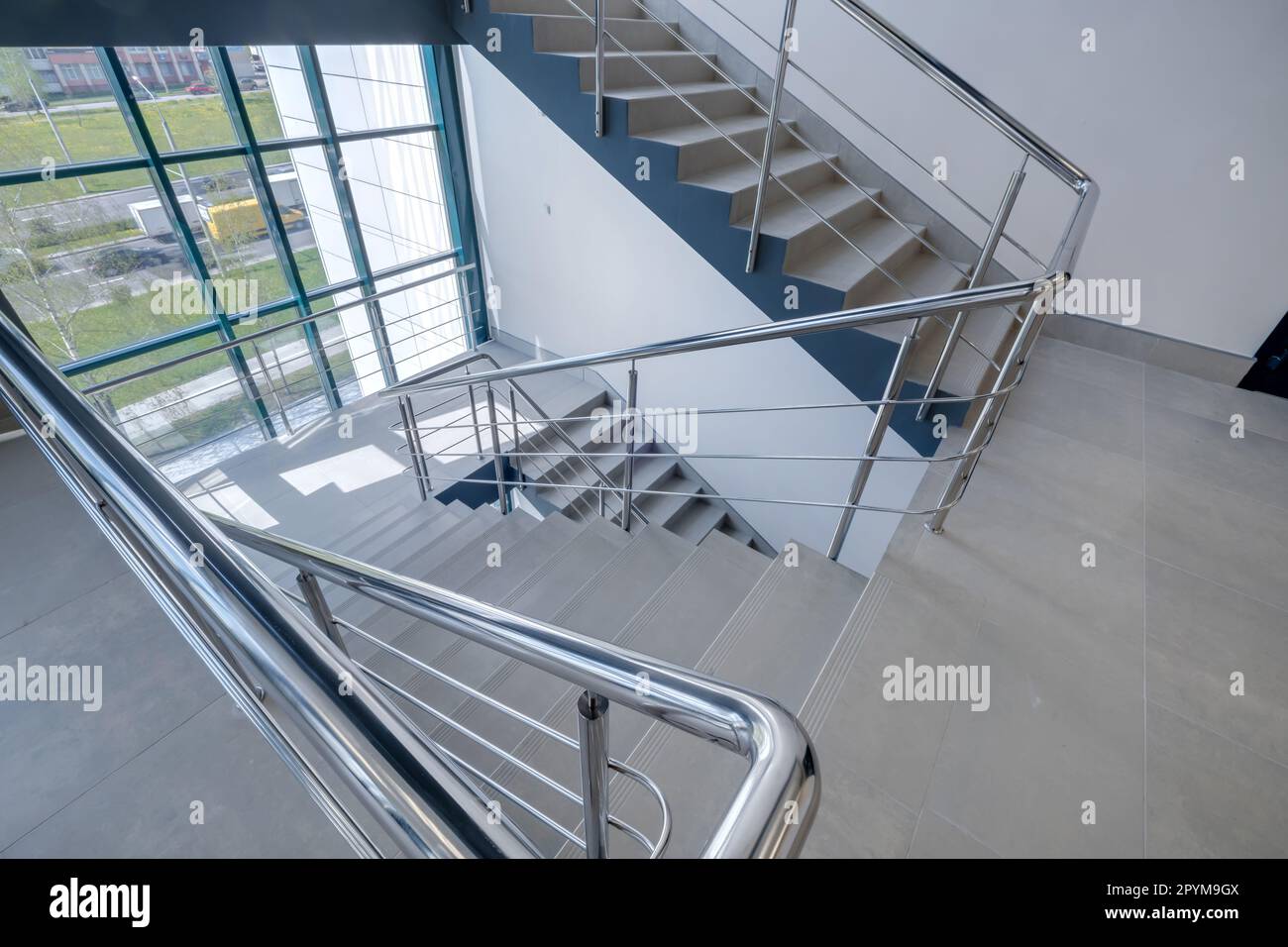 stairs  emergency and evacuation exit stair in up ladder in a new office building. Stock Photo
