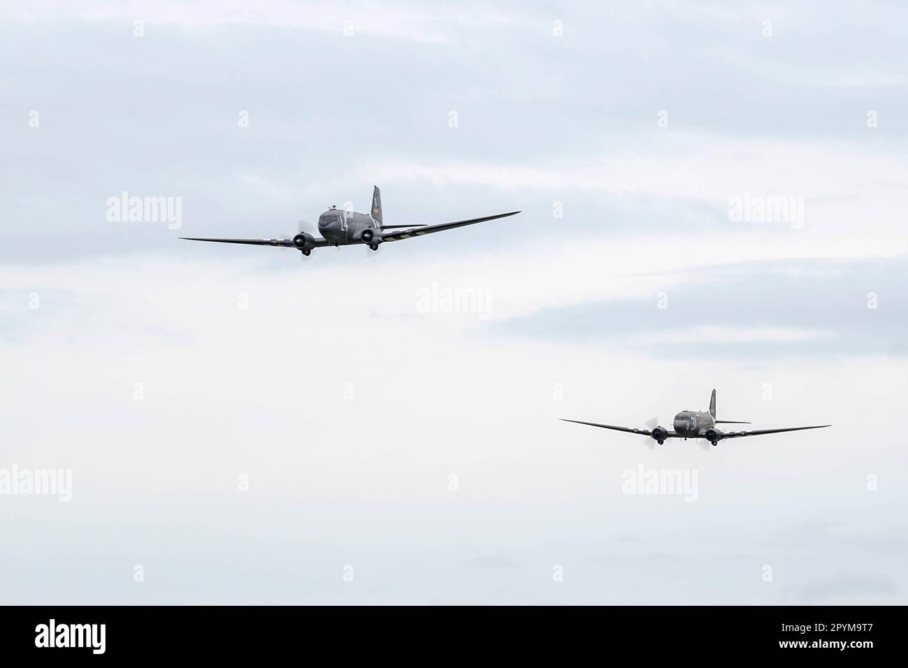 Two Douglas C-47 Skytrains flying over Shoreham Airfield Stock Photo
