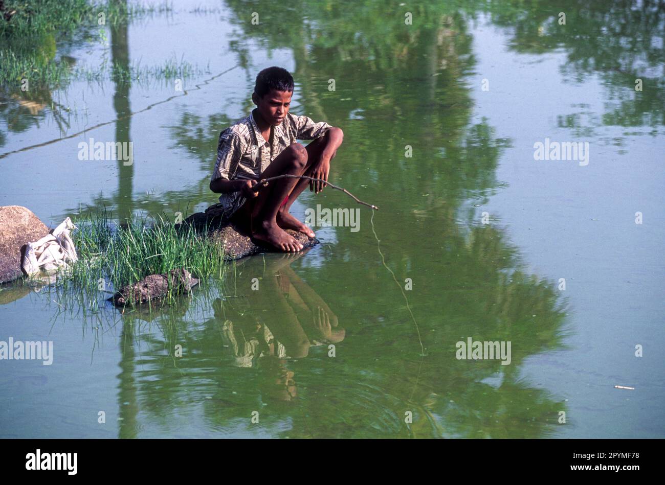 A boy angling, Tamil Nadu, South India, India, Asia Stock Photo