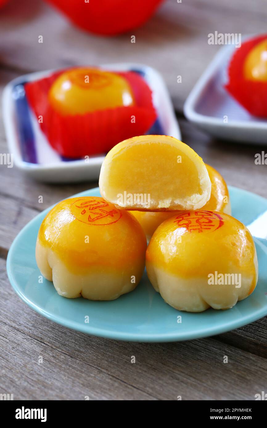 Chinese pastry on the dish and have Chinese alphabet which means Good luck and Good health are on top of dessert. Stock Photo