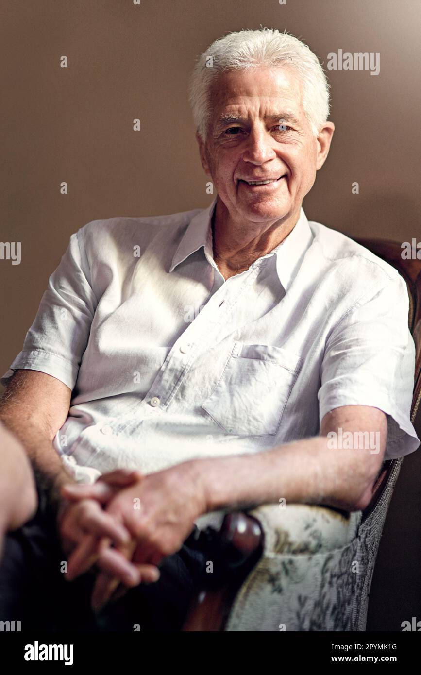 age-is-just-a-number-after-all-portrait-of-a-senior-man-at-home-stock
