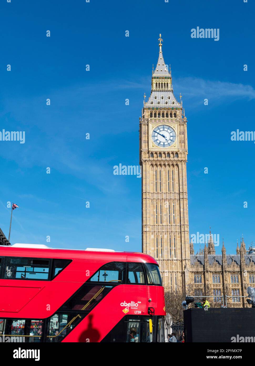 London UK May 3 2023 Iconic London  red Bus and BIG BEN /the Houses of Parliament  in view . Both the building and Big Ben  have been cleaned and gilted  ahead of the Royal processions' route for the Coronation of King Charles III and Queen Camilla on 6 May. . Credit Gary Blake / Alamy live news Stock Photo