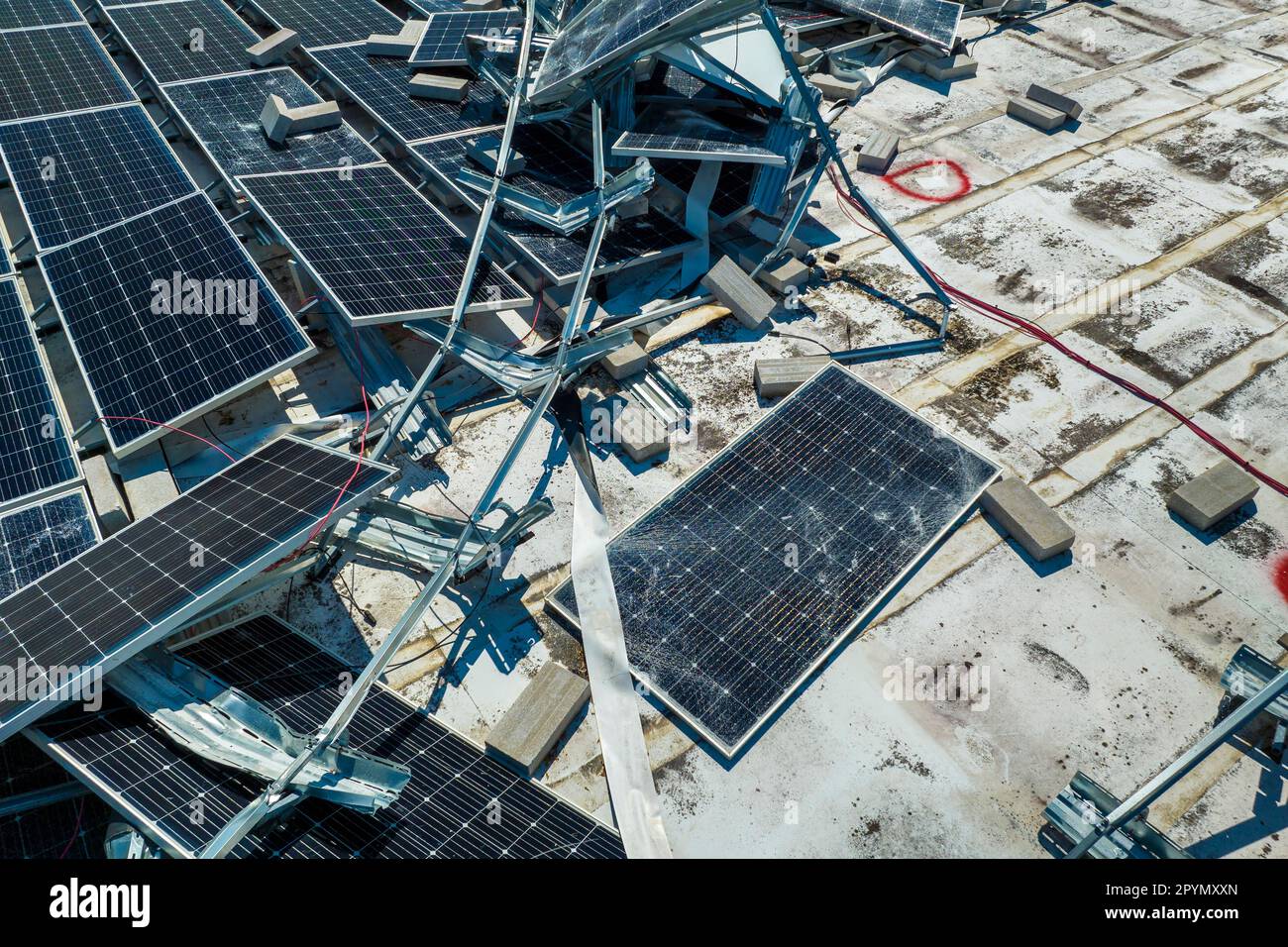 Aerial view of damaged by hurricane wind photovoltaic solar panels