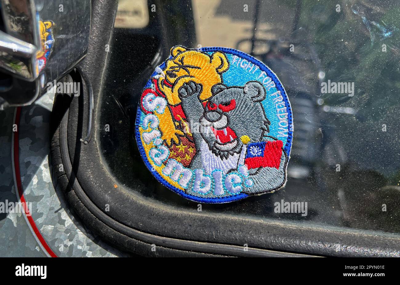 A Philippines tricycle showing support to Taiwan independence with the viral punching Winnie the Pooh badge patch reading 'Fight for Freedom,Scramble' Stock Photo