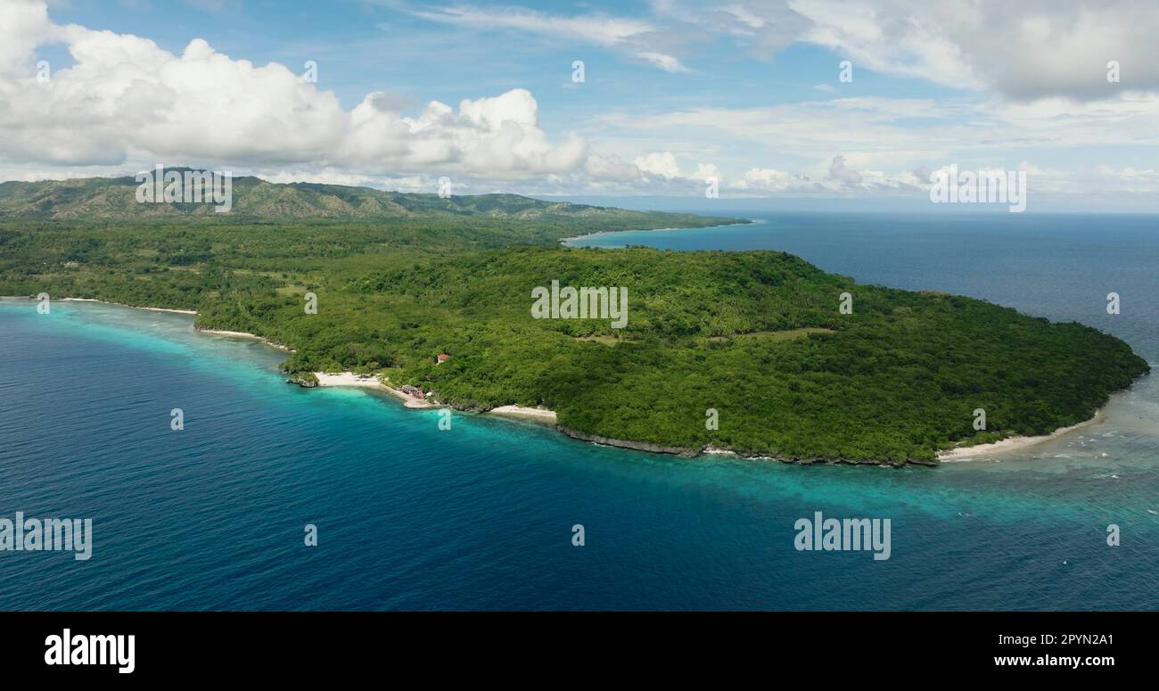 Aerial shots of this Magnificent Island surrounded by calm and deep blue sea water. Siquijor, Philippines. Stock Photo