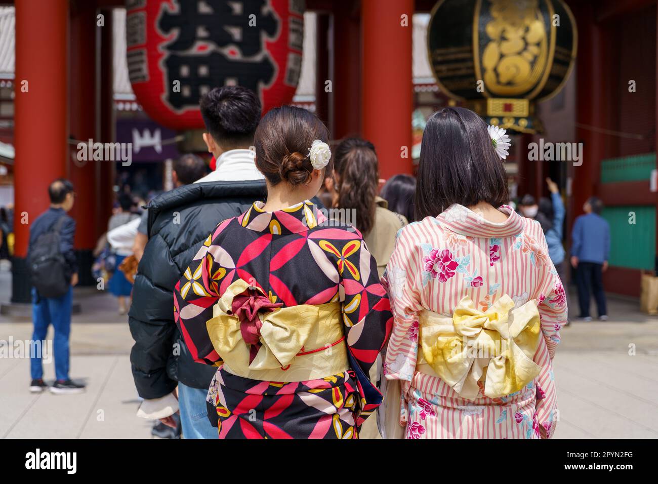Young girl wearing Japanese kimono standing in Kyoto, Japan. Kimono is