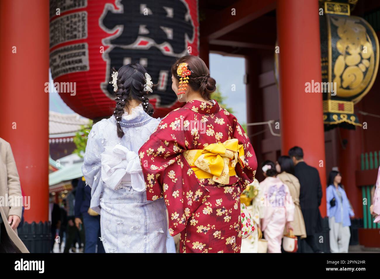 Young girl wearing Japanese kimono standing in Kyoto, Japan. Kimono is
