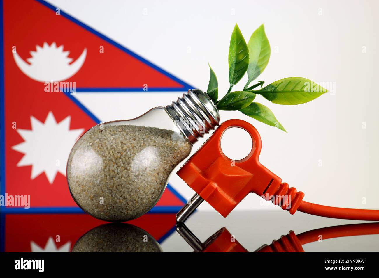 Plug, plant growing inside the light bulb and Nepal Flag. Green eco