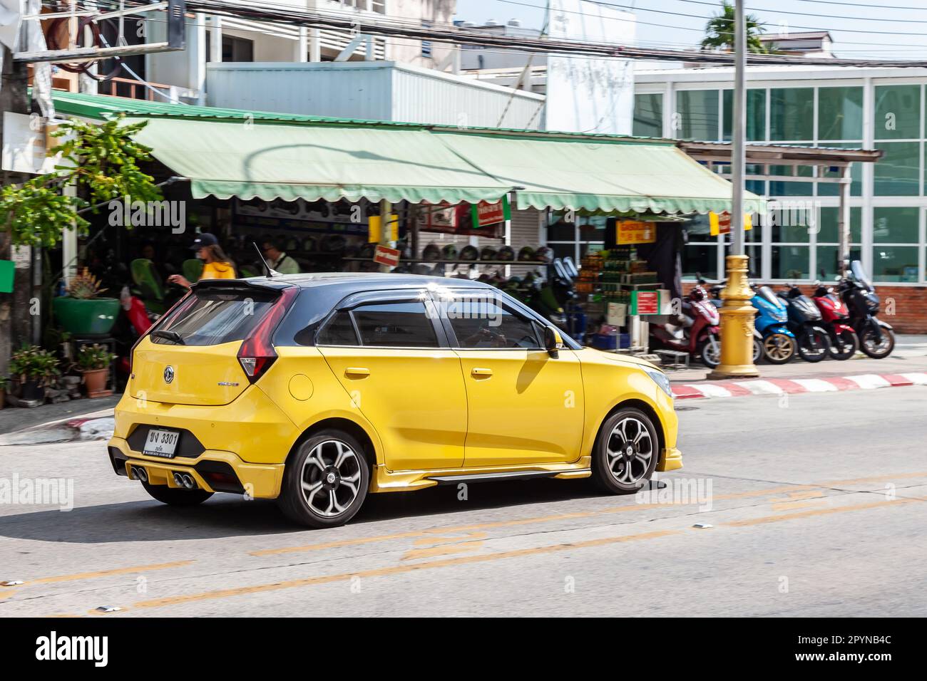 Thailand, Phuket - 03.31.23: Yellow car model Morris Garage MG3 hatchback body on the street. Stock Photo
