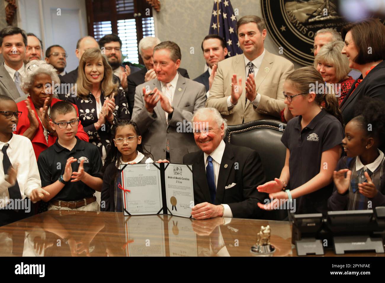 South Carolina Gov. Henry McMaster shows his signature on a bill that will allow parents to spend public money on private schools as part of a small-scale pilot program on Thursday, May 4, 2023, in Columbia, S.C. (AP Photo/Jeffrey Collins) Stock Photo