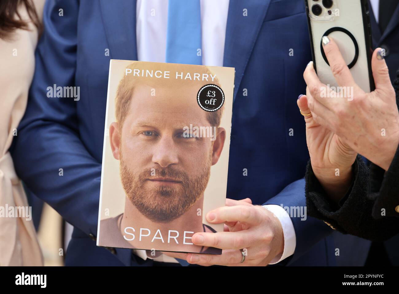 pic shows:   Coronation Build up  Can it be Harry and Meghan in The Mall with Harry pushing his book “Spare”  Several heads were turned but in the end Stock Photo