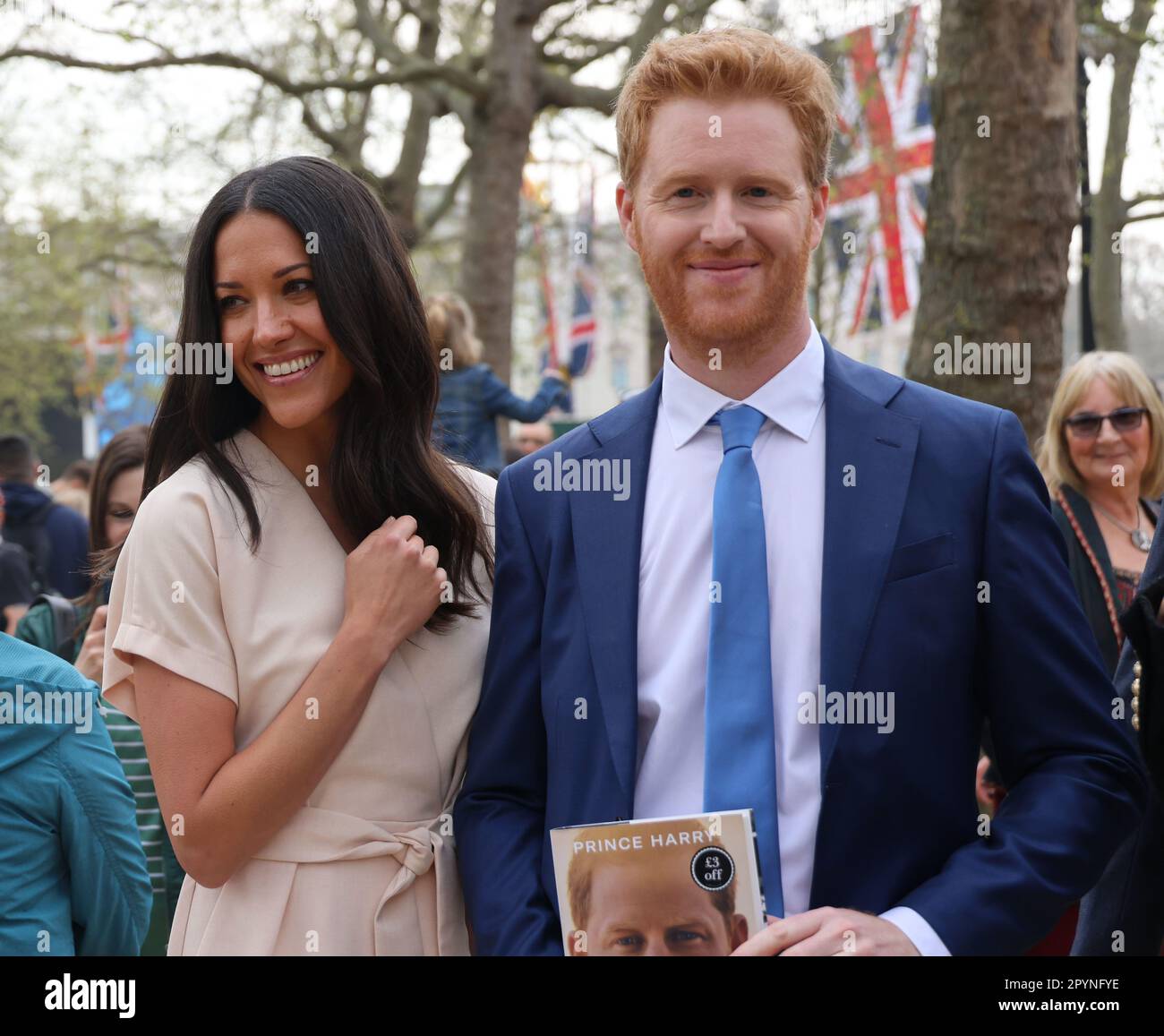 pic shows:   Coronation Build up  Can it be Harry and Meghan in The Mall with Harry pushing his book “Spare”  Several heads were turned but in the end Stock Photo