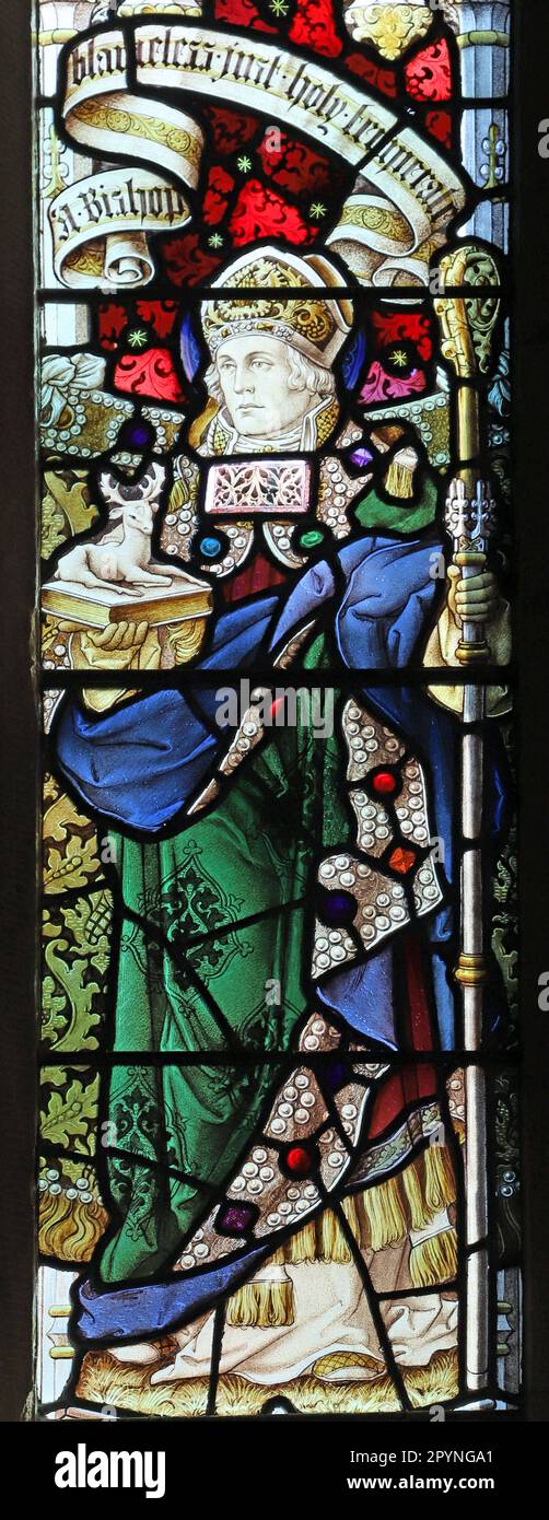 Stained glass window by Percy Bacon & Brothers depicting St Aidan of Lindisfarne, St Mary's Church, Stannington, Northumberland Stock Photo