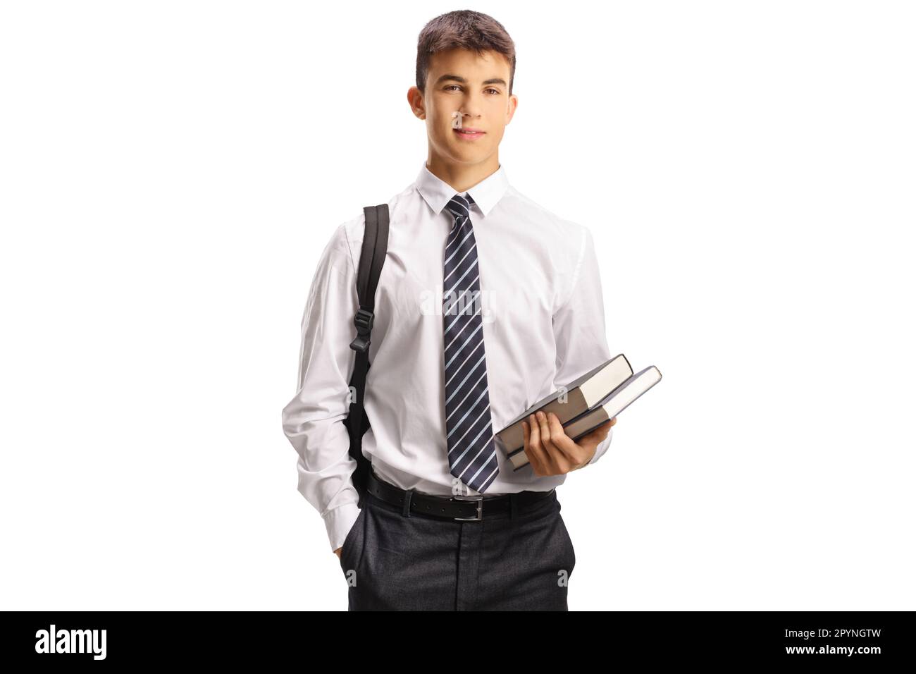 Male teen student in a school uniform holding books isolated on white background Stock Photo