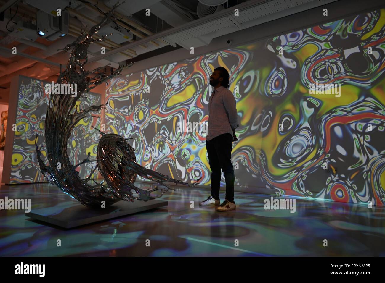 Digital artist OSF surrounded by immersive art by Agoria and sculpture