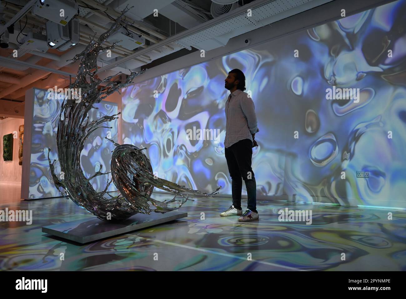 Digital artist OSF surrounded by immersive art by Agoria and sculpture