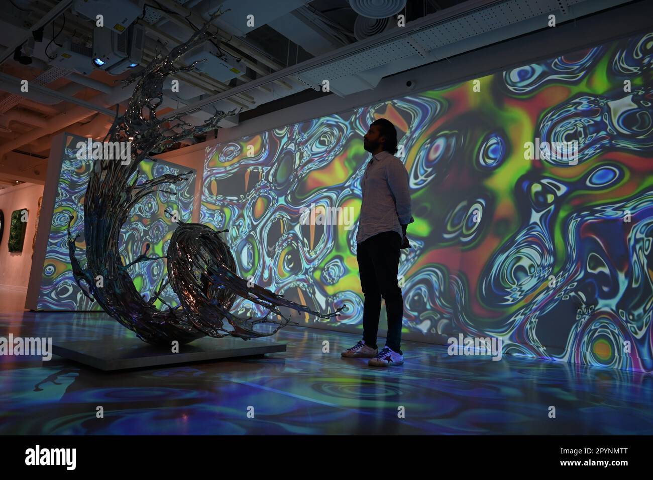 Digital artist OSF surrounded by immersive art by Agoria and sculpture
