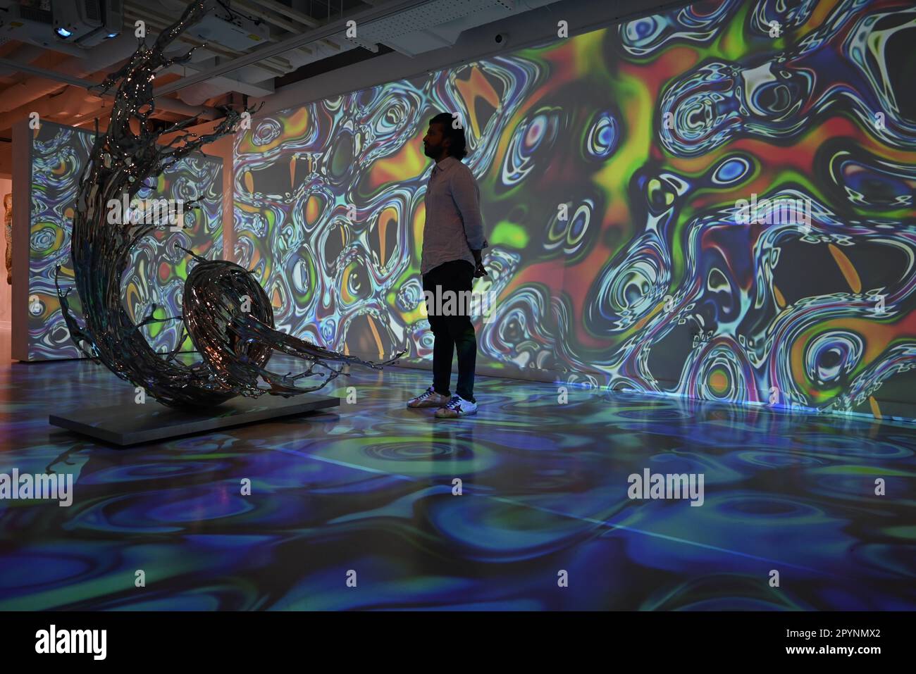 Digital artist OSF surrounded by immersive art by Agoria and sculpture