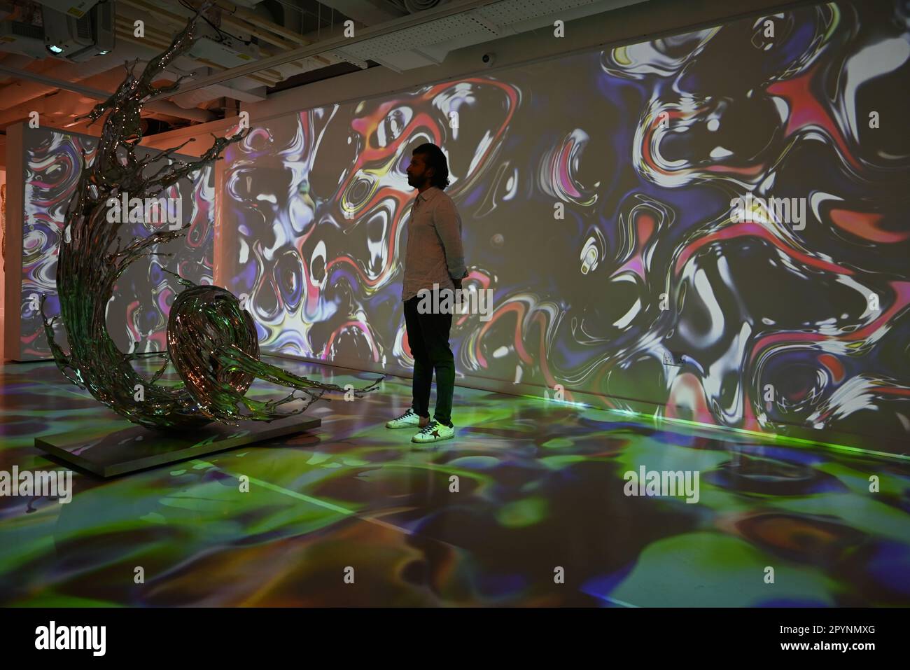 Digital artist OSF surrounded by immersive art by Agoria and sculpture