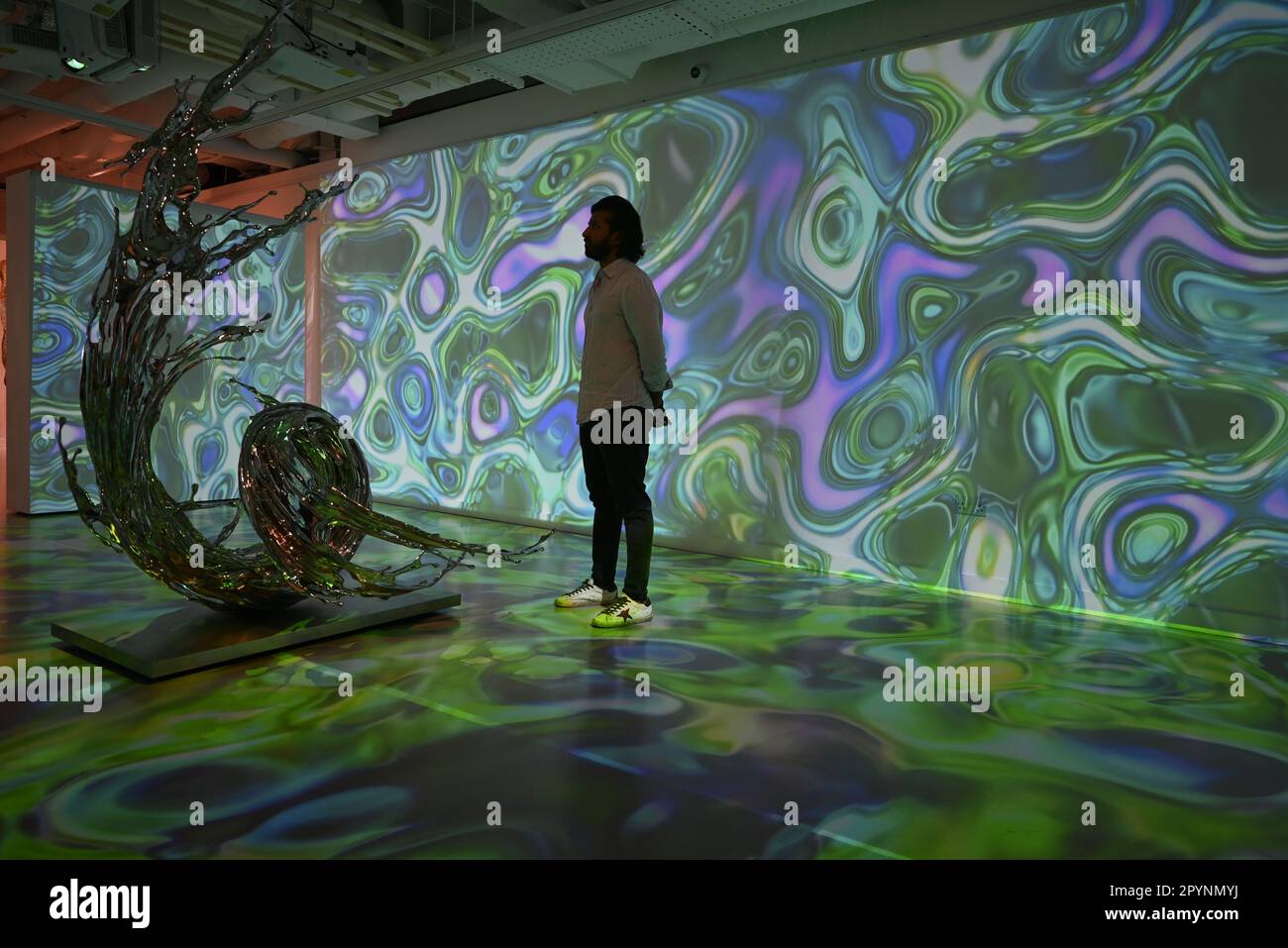 Digital artist OSF surrounded by immersive art by Agoria and sculpture