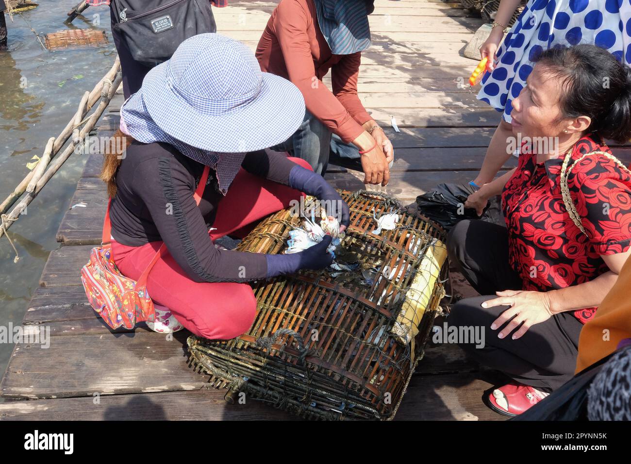 A lively morning market in Kep,Cambodia. Most sellers sell blue crab which is still alive Stock Photo