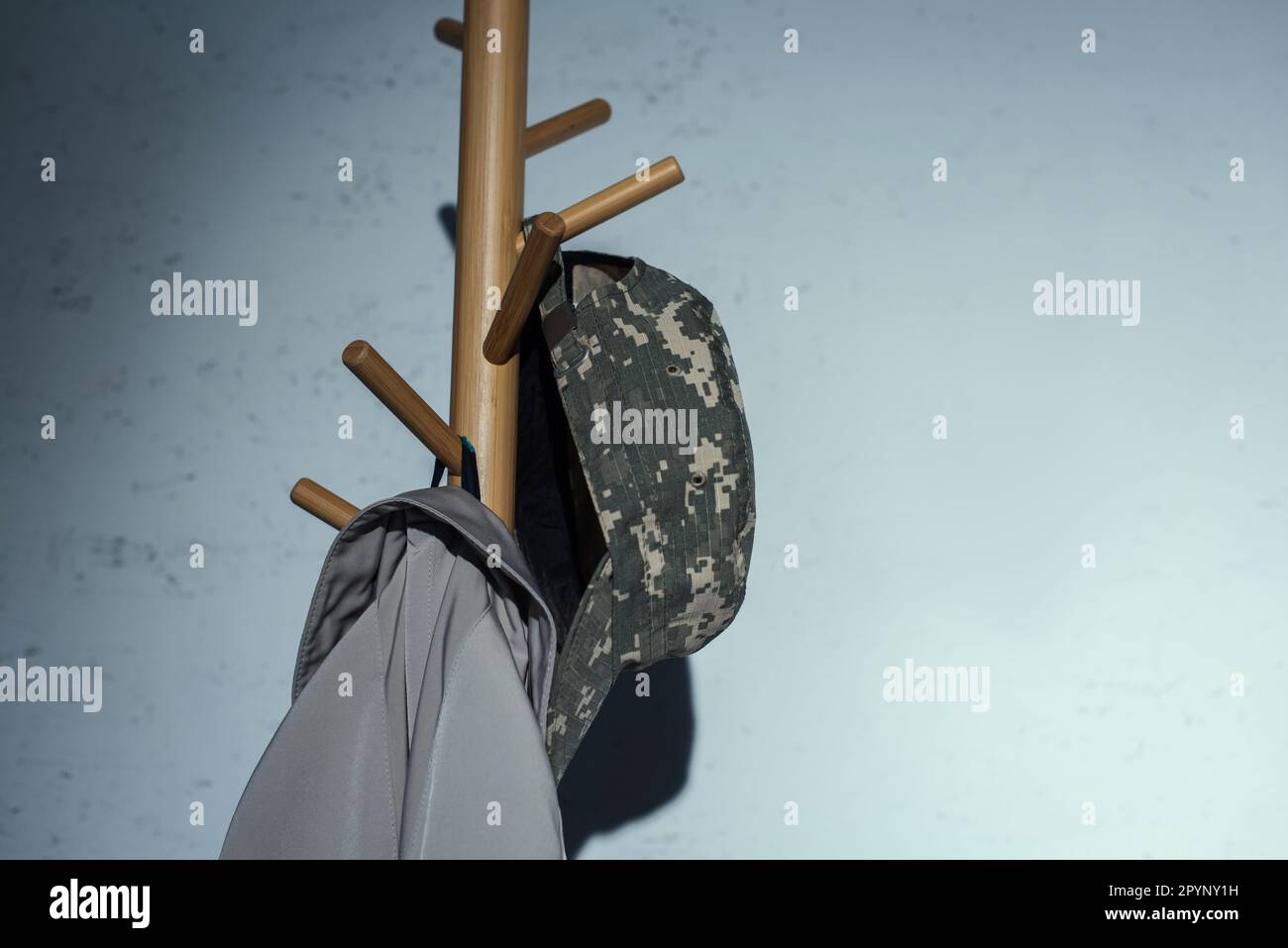 Military cap hanging on floor hanger at home at night,stock image Stock Photo