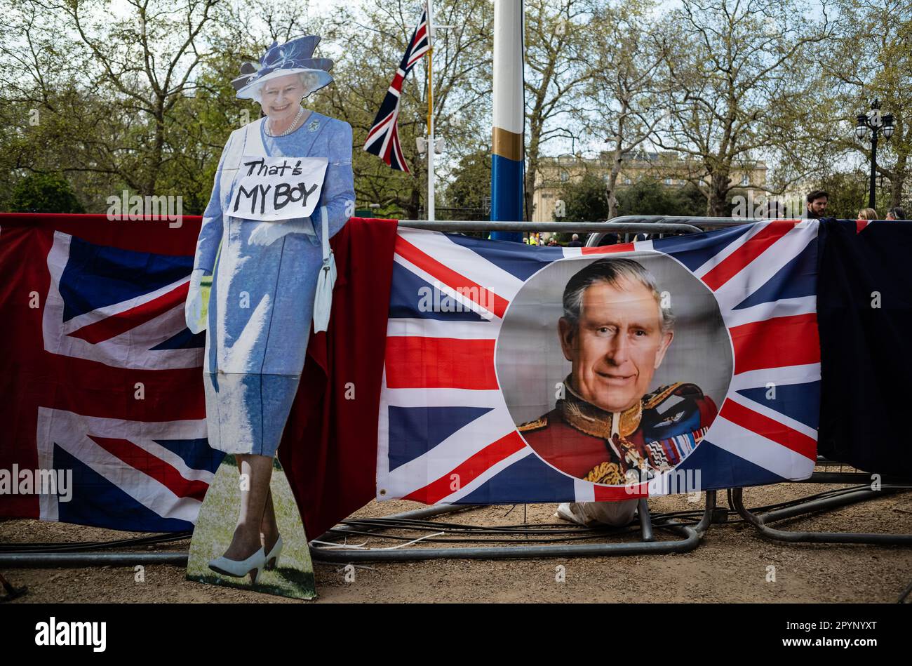 May 4, 2023. A cardboard cutout of the late Queen Elizabeth stands next to a flag showing the image of Charles III, prior ot his coronation. London, UK. (Tennessee Jones - Alamy Live News) Stock Photo