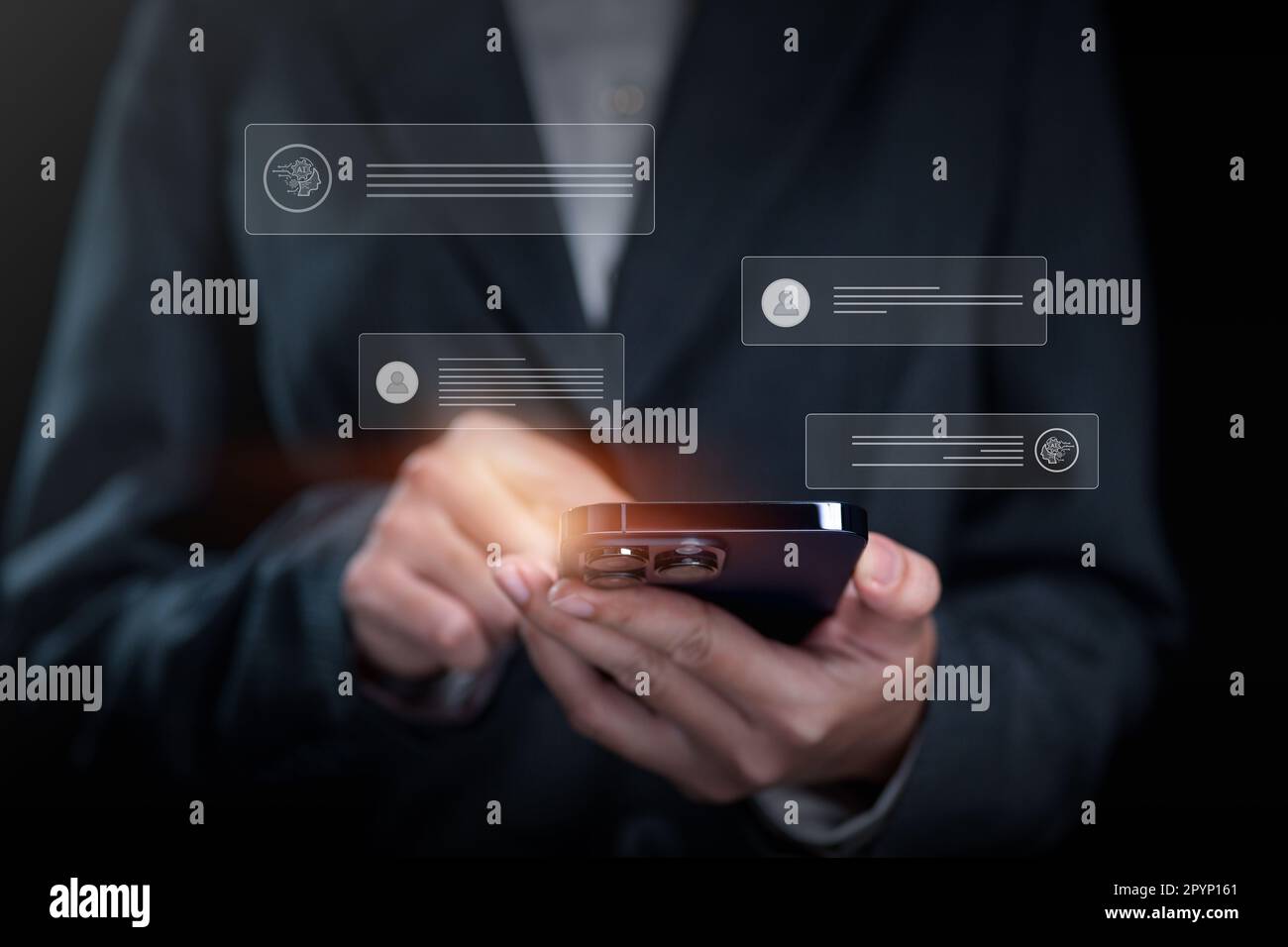 Businessman using chatbot on smartphone with Artificial Intelligence Stock Photo