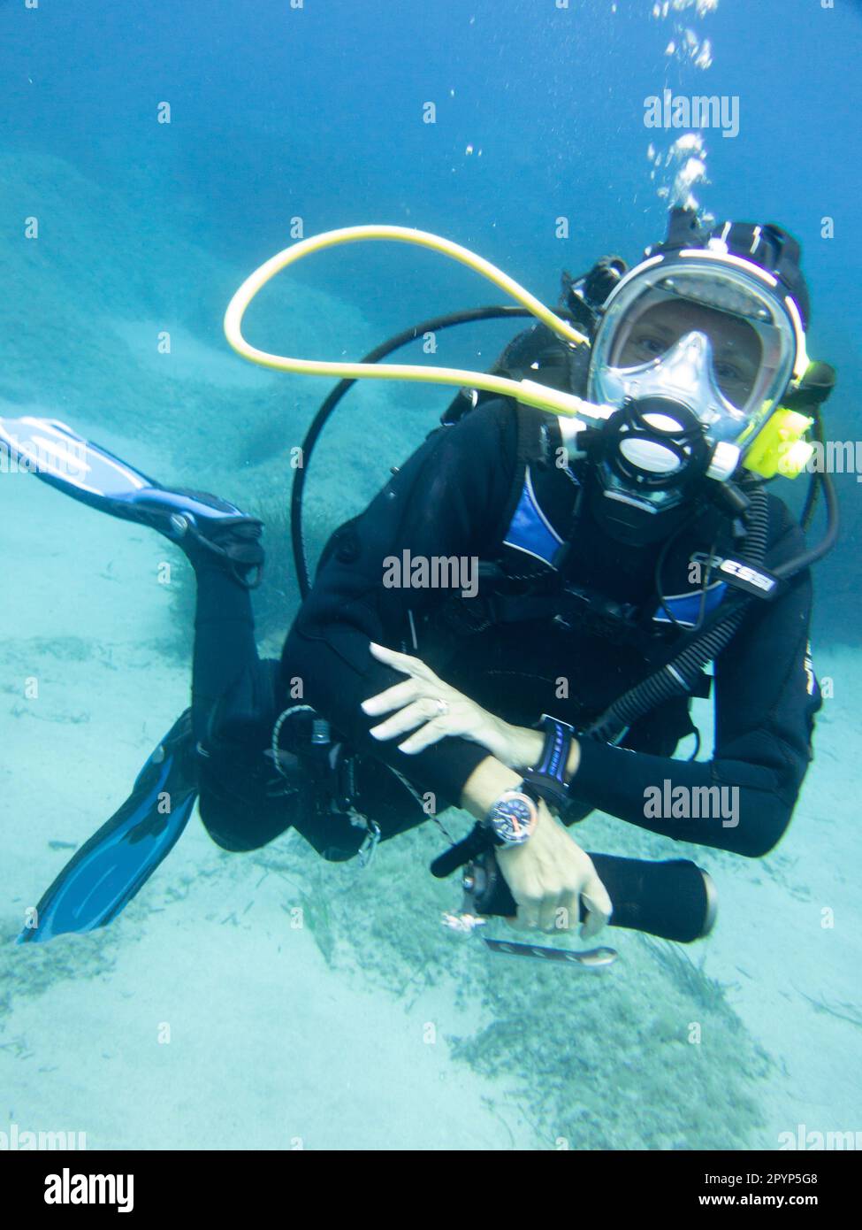 Scuba Diver with full face mask looking at the camera Stock Photo