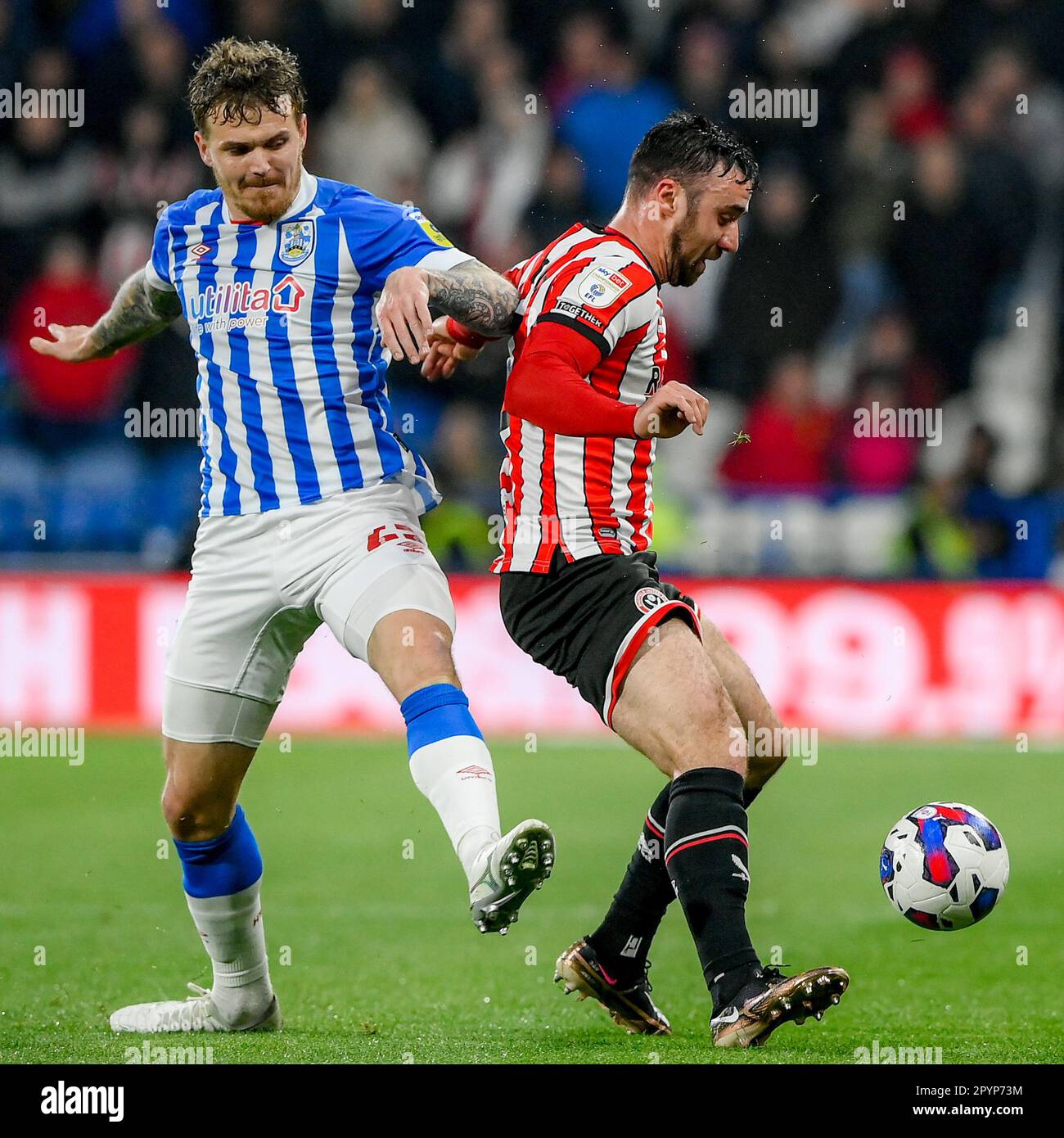 Danny Ward 25 of Huddersfield Town challenges ,Enda Stevens during the
