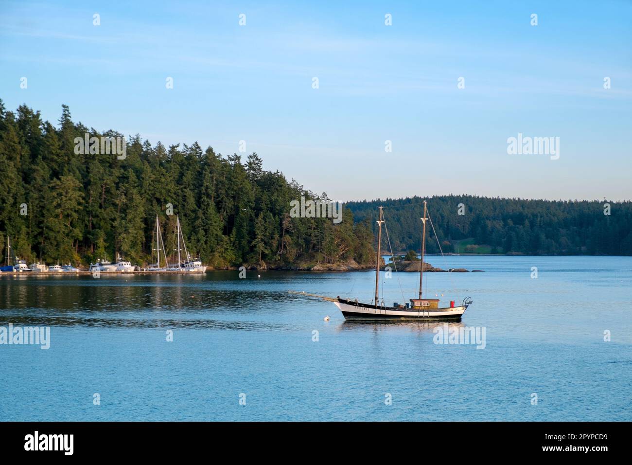 An old wooden sailboat off Orcas Island, Washington, USA; San Juan Islands Stock Photo