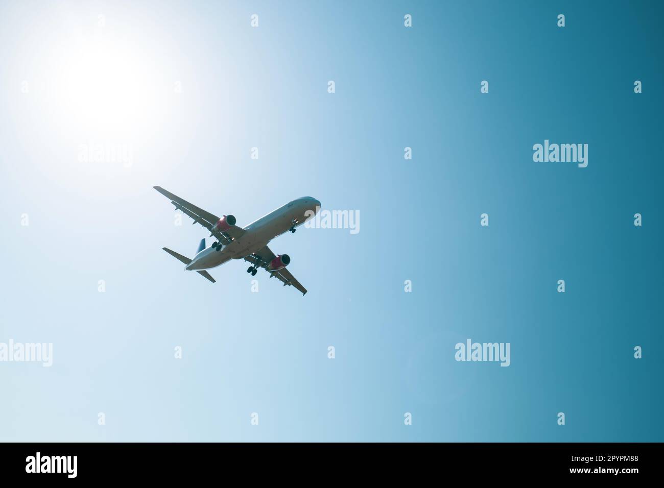 Landing of a commercial aircraft while aproaching airport Stock Photo