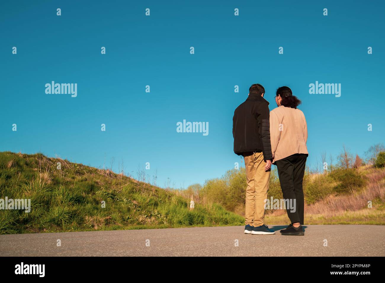 Couple standing on a countryside road near Copenhagen in Denmark Stock Photo