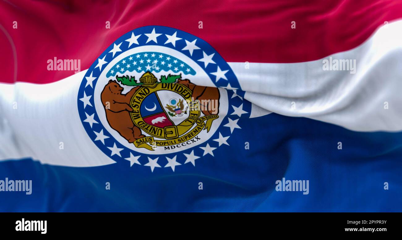 Closeup of the Missouri state flag waving. Red, white, blue horizontal