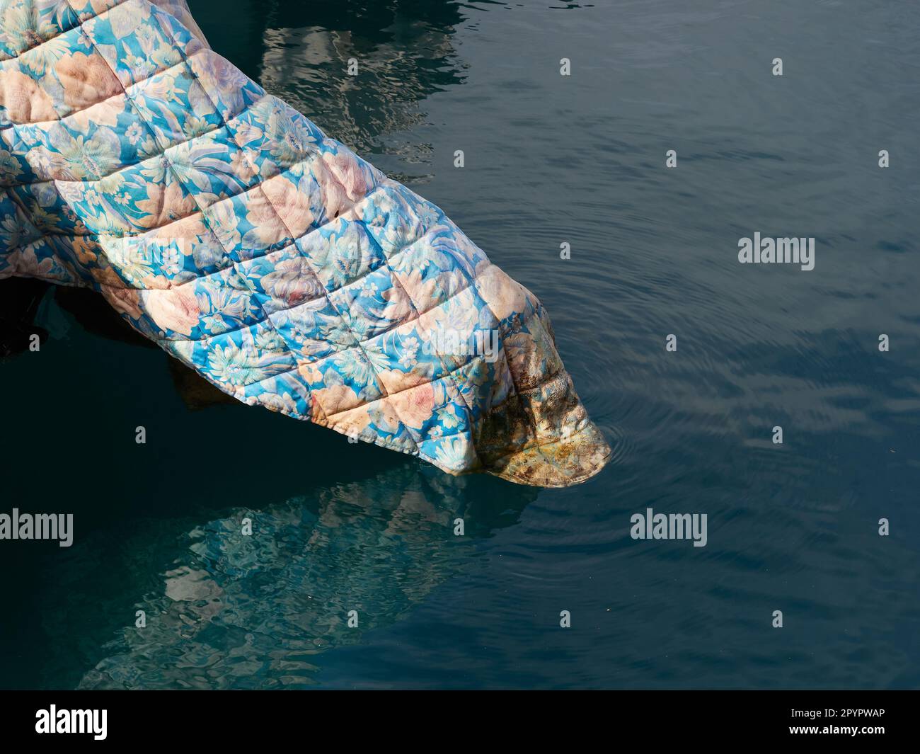 Blanket that covers a boat engine in the water Stock Photo Alamy