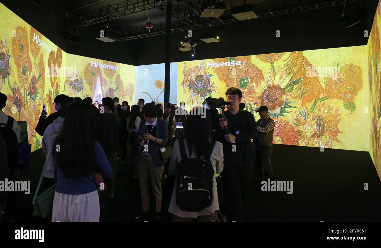 SHANGHAI, CHINA - APRIL 27, 2023 - Visitors visit a digital exhibition  titled "Following the Light Van Gogh" at the booth of high-end TV brand  Hisense at the Shanghai Home Electronics Fair
