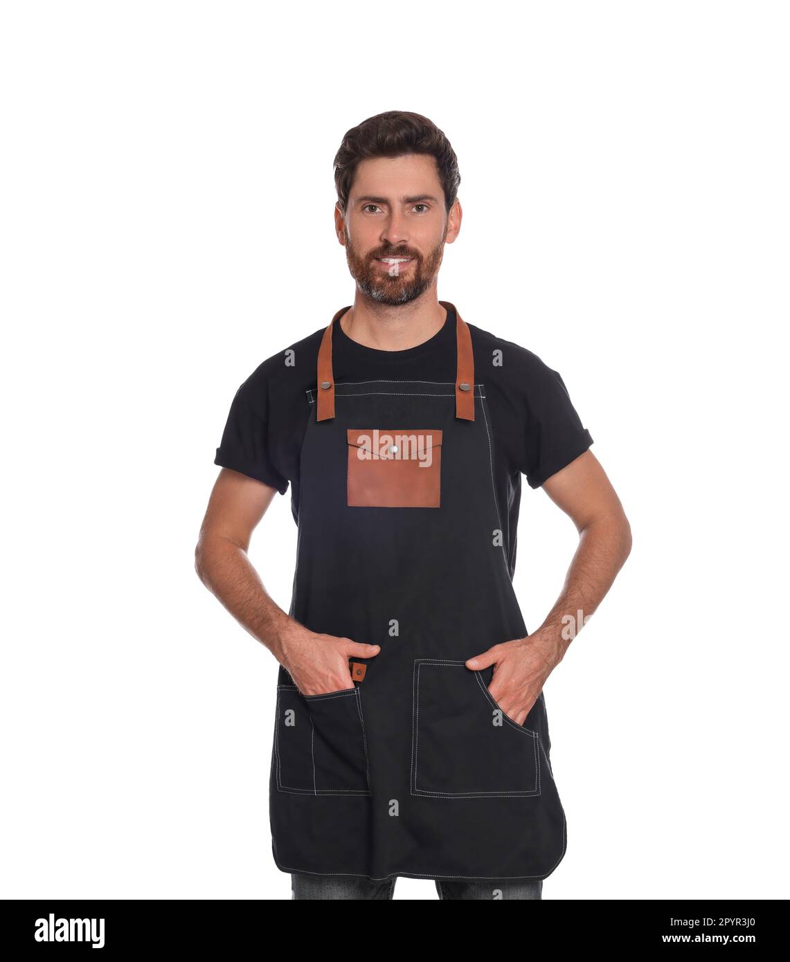 Professional hairdresser wearing apron on white background Stock Photo