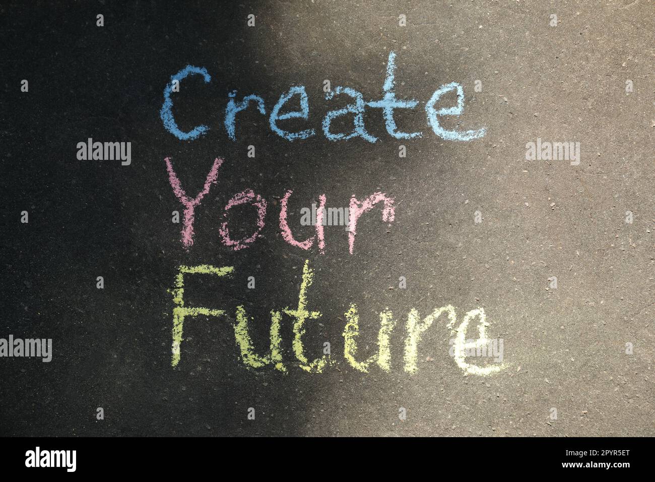 Phrase Create Your Future written on asphalt, top view Stock Photo
