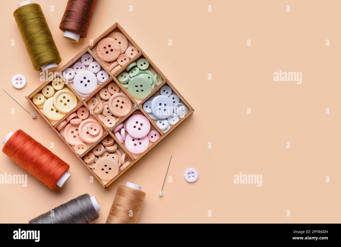 Composition with different buttons, thread spools and ball pins on ...