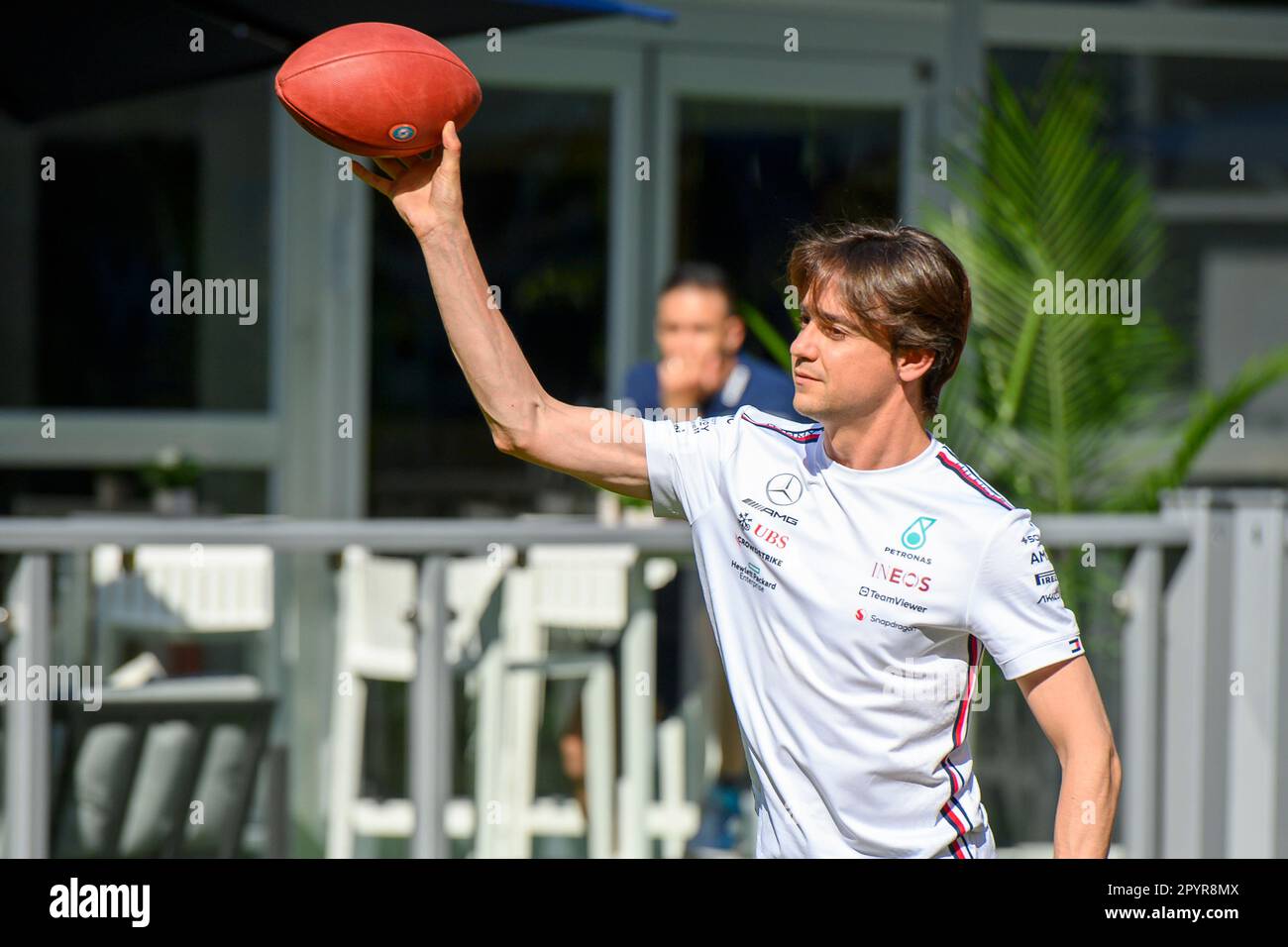 4th May 2023: Miami International Autodrome, Miami Gardens, Florida, USA: Formula 1 Crypto.com Miami Grand Prix 2023: Arrival and Inspection Day: MoneyGram Haas reserve driver Esteban Gutierrez throws a football as  instructed by NFL Miami Dolphins players at the Team Village. Stock Photo