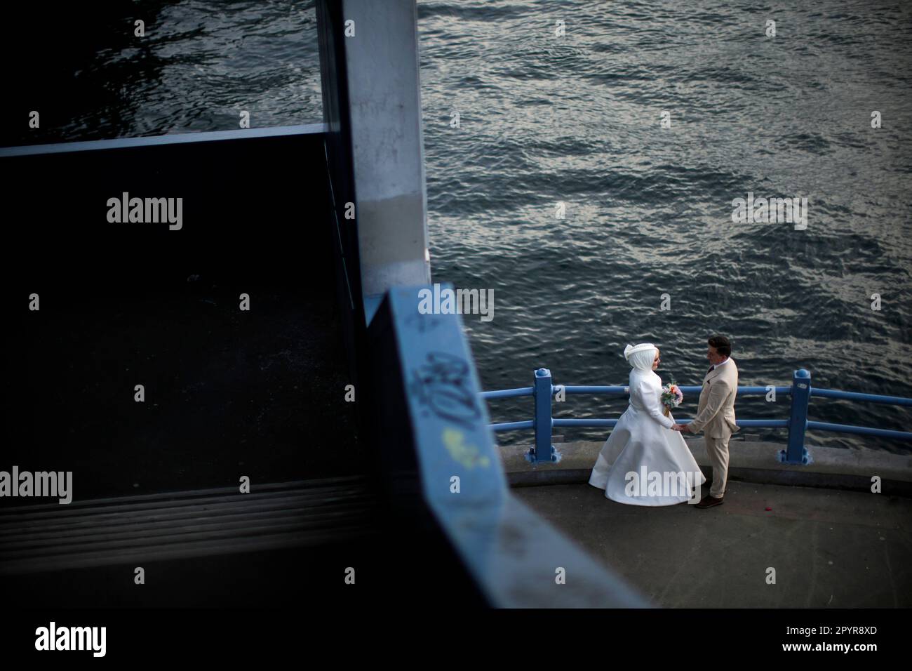 A young couple poses for a video and photo session at Galata bridge in  Istanbul, Turkey, Thursday, May 4, 2023. (AP Photo/Francisco Seco Stock  Photo - Alamy