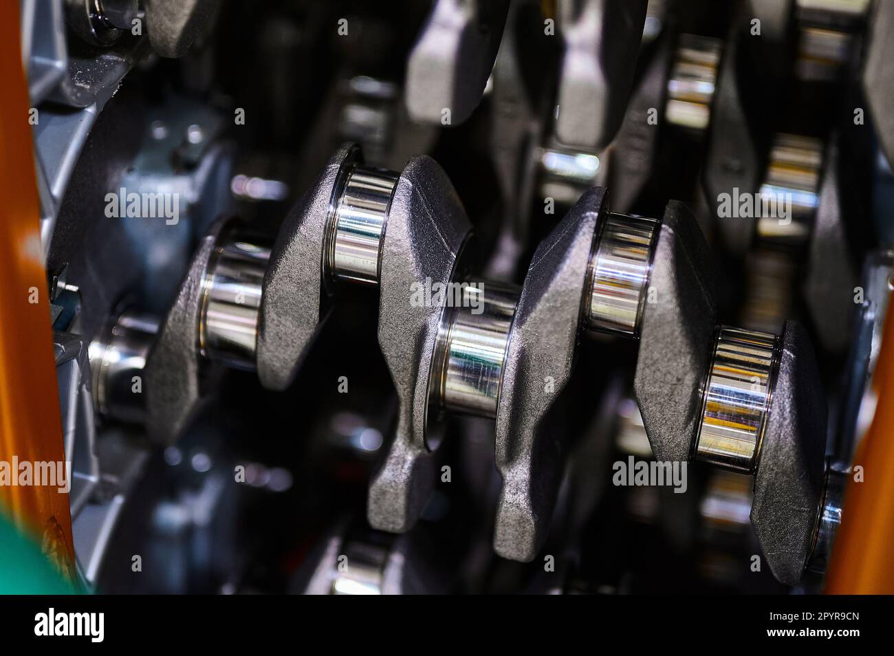 Crankshaft of an automobile engine closeup. Polished shaft journals