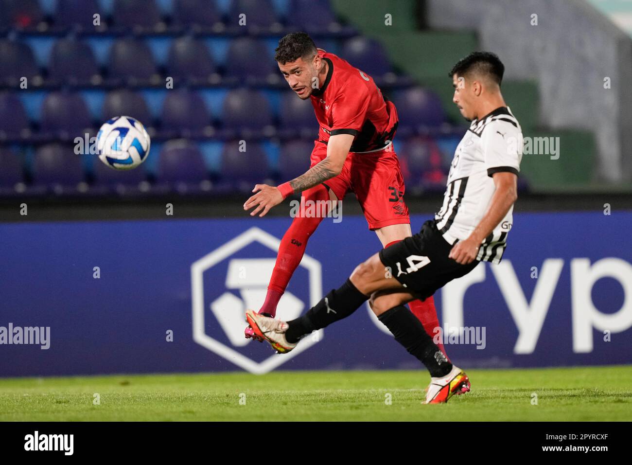 Ze Ivaldo of Brazil's Athletico Paranaense heads the ball in an attempt to  score as Diego Viera of Paraguay's Libertad challenges him during a Copa  Libertadores round of sixteen second leg soccer