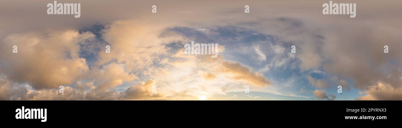 Dark blue sunset sky with glowing golden Cumulus clouds in seamless ...