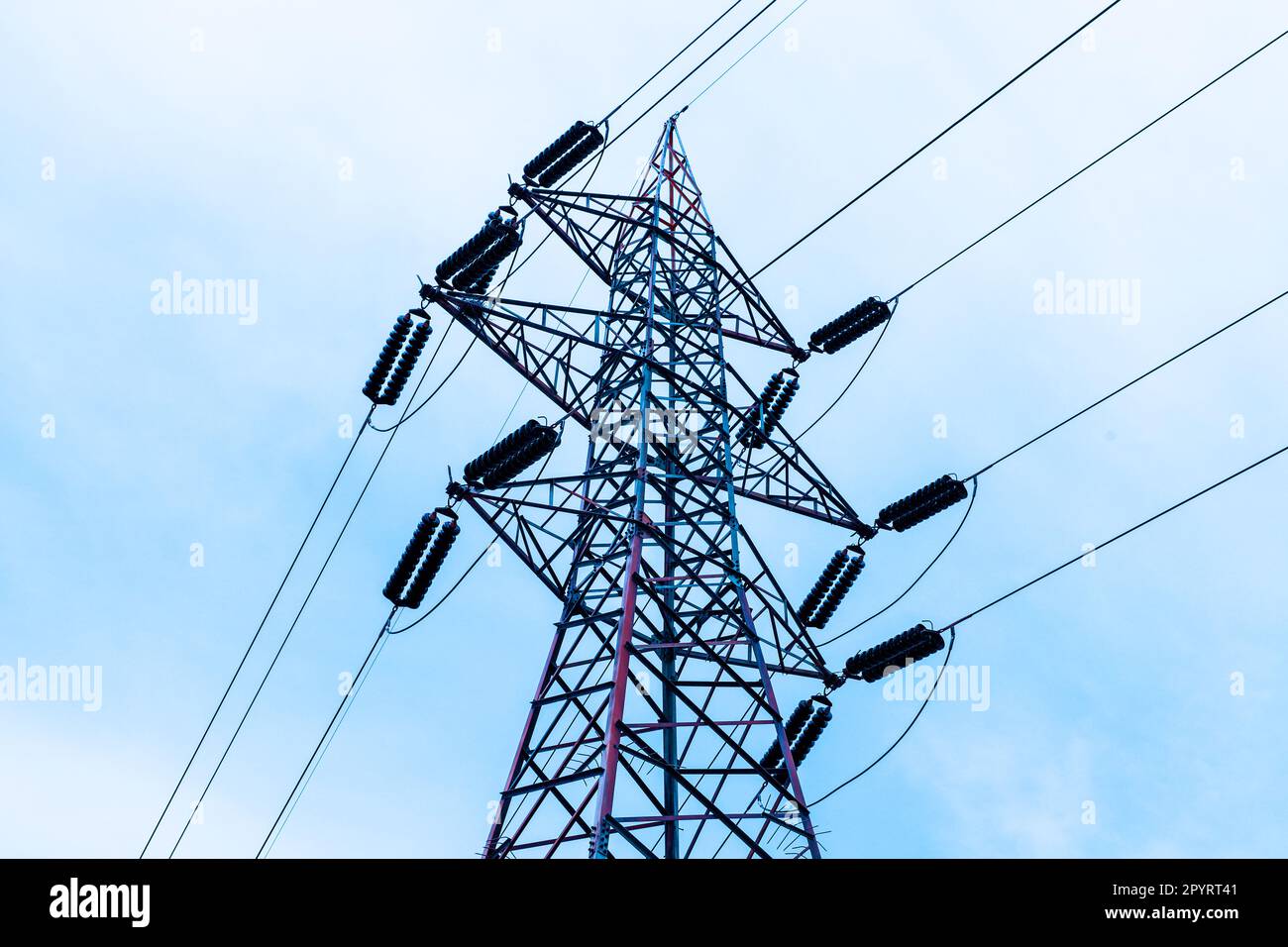 Power line for electric power. Conductive system of long extension, wire, cable for the transportation of electrical current. Power supply for the peo Stock Photo