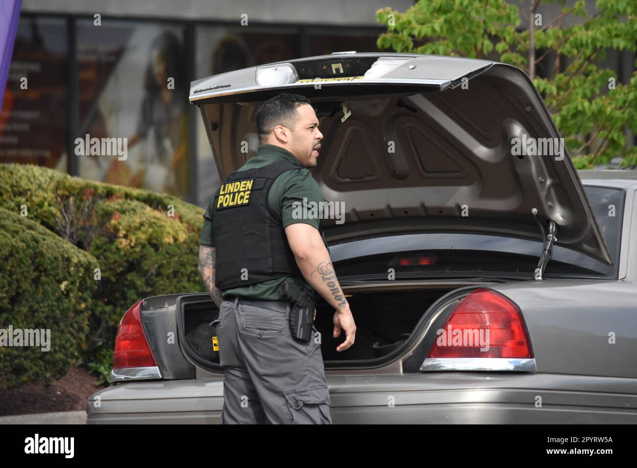 Police officer from the Linden police department arrive at the crime scene to collect evidence