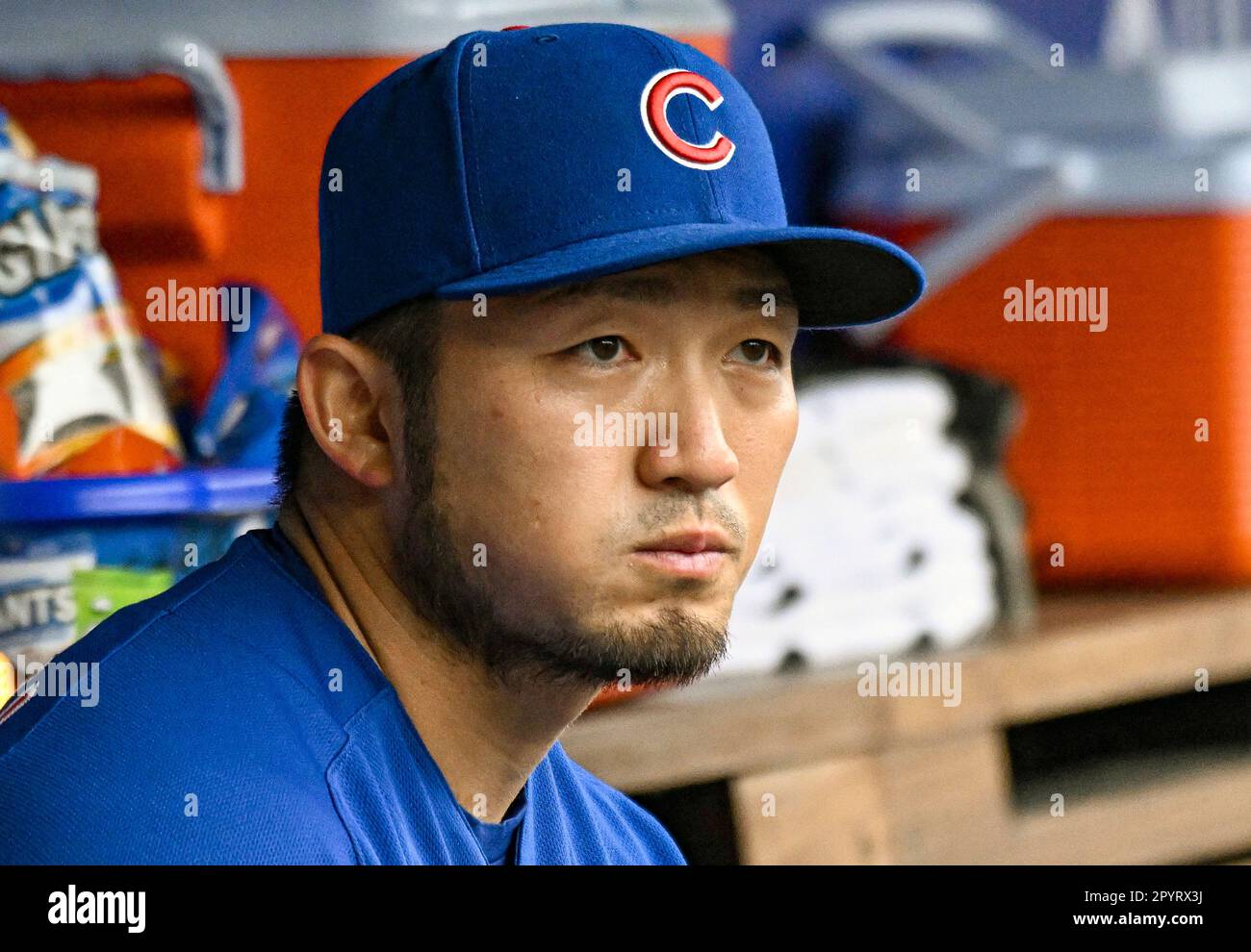 The Chicago Cubs' Seiya Suzuki (R) sits in the dugout after striking out in  the seventh inning of a baseball game against the Arizona Diamondbacks on  May 22, 2022, at Wrigley Field