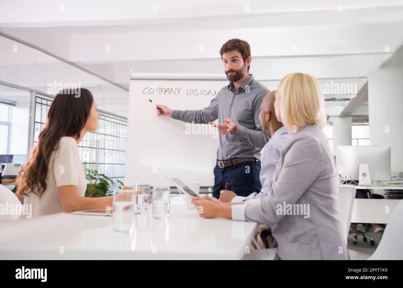 Designs For The Future. A Businessman Giving A Presentation To His 